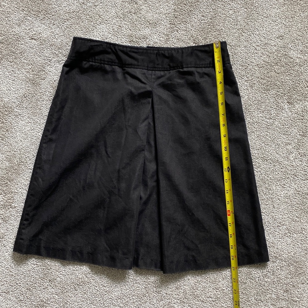 Kenar Black skirt with flirty pleat